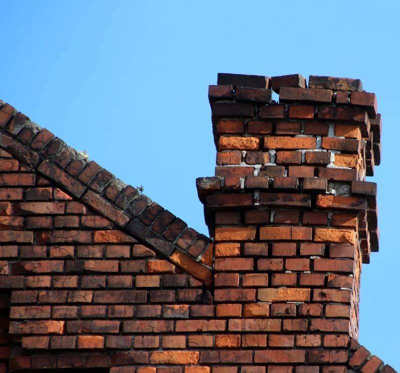Signs Your Beverly Hills Home Needs a Chimney Inspection Damaged chimney on an Beverly Hills home showing cracks and missing mortar